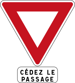 Upside down red triangle French road sign for give way.