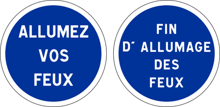 Two circular blue road signs with white borders. 