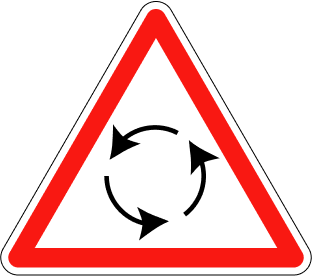 A triangular road sign with a red border features three black circular arrows in an anticlockwise circle indicating an upcoming roundabout.