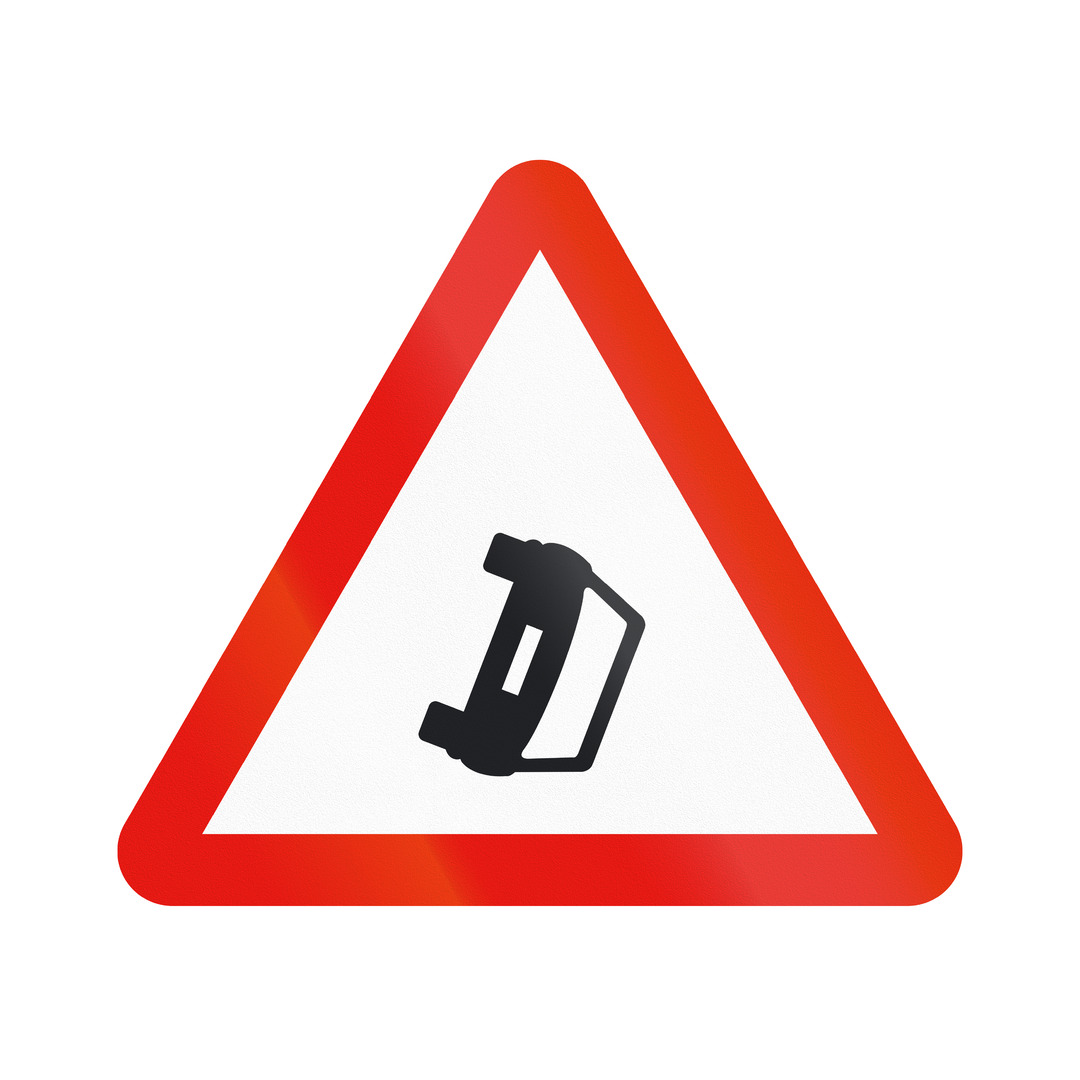 Red triangle with a white background and a black car on its side in the middle to demonstrate an accident hotspot.