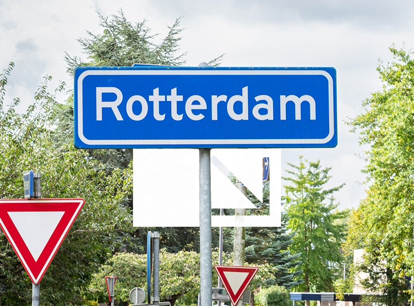 Rotterdam road sign at a junction, showing common Dutch road signs for travellers driving in the Netherlands with car hire excess insurance.