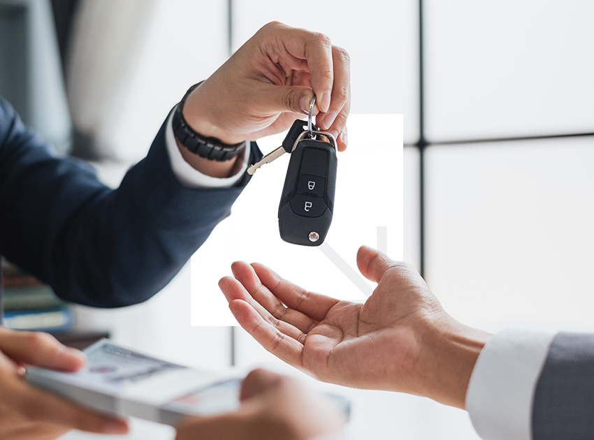 One person handing car keys to another, reflecting smart rental choices including using car hire excess insurance to reduce costs.